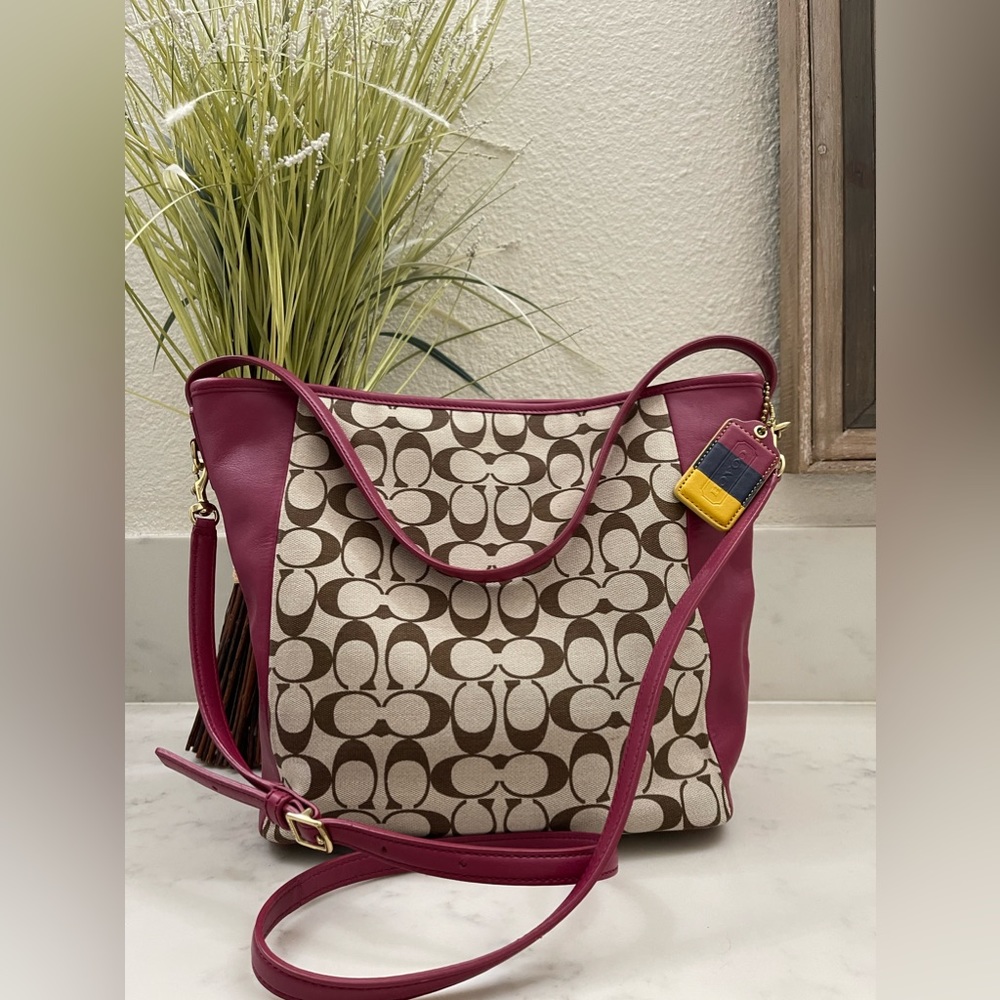 Coach Signature canvas and dark pink purse.